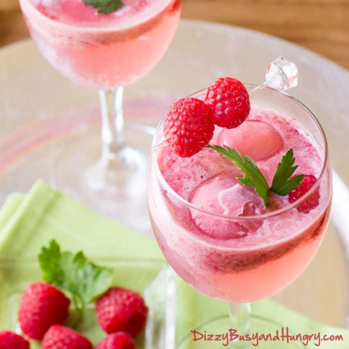 Raspberry Sorbet Wine Spritzer | DizzyBusyandHungry.com - So pretty, refreshing, and delicious! Perfect to serve for a summer evening gathering!